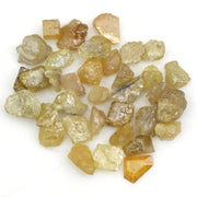 natural fancy yellow rough diamond with raw uncut surface and loose irregular stone