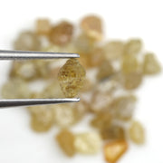 natural fancy yellow rough diamond with raw uncut surface and loose irregular stone