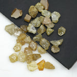 natural fancy yellow rough diamond with raw uncut surface and loose irregular stone
