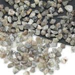 mixed color natural diamond chips showing varied raw uncut shapes for jewelry use