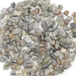 grey raw diamond with an uncut rough surface for jewelry making and custom designs