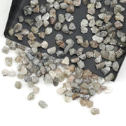 grey raw diamond with an uncut rough surface for jewelry making and custom designs