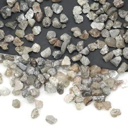 grey raw diamond with an uncut rough surface for jewelry making and custom designs