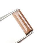 brown colour diamond baguette earrings and diamond eternity band baguette