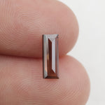 brown colour diamond baguette earrings and diamond eternity band baguette