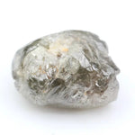 Collection of raw gems and loose rough diamonds.