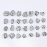 Grey diamond gemstone with natural smoky color and brilliant polish
