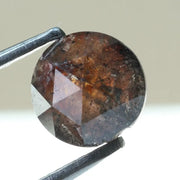 0.78 carat brownish black natural diamond round cut loose stone with subtle dual tone color blend