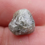 Loose raw diamond stones with natural sparkle.
