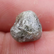 Loose raw diamond stones with natural sparkle.