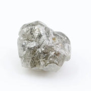 Large raw gemstones and rough diamond crystals displayed together.