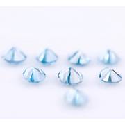 Eight vivid blue pear cut lab grown diamonds displayed on white background, featuring brilliant faceting, teardrop shape, and rich ocean blue tones ideal for custom engagement rings and fine jewelry.