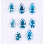 Eight vivid blue pear cut lab grown diamonds displayed on white background, featuring brilliant faceting, teardrop shape, and rich ocean blue tones ideal for custom engagement rings and fine jewelry.