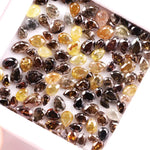 Natural fancy color pear shape rose cut diamond lot featuring mixed shades of brown, yellow and champagne loose diamonds, ideal for custom jewelry making, artisan rings, earrings and unique gemstone designs.