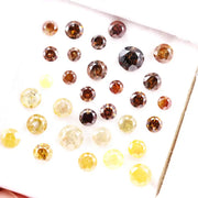 Assorted round brilliant cut natural diamonds in yellow and brown colors, loose fancy diamonds ideal for engagement rings, custom jewelry making, and diamond supply collection.