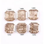 Six emerald cut lab grown diamonds with soft champagne color and visible internal growth pattern inclusions, arranged in two rows and numbered 1 through 6 on a white background.