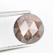 0.78 carat brownish black natural diamond round cut loose stone with subtle dual tone color blend