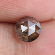 0.78 carat brownish black natural diamond round cut loose stone with subtle dual tone color blend
