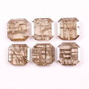 Six emerald cut lab grown diamonds with soft champagne color and visible internal growth pattern inclusions, arranged in two rows and numbered 1 through 6 on a white background.