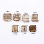Emerald cut lab grown diamond featuring natural-inspired linear inclusions in a step cut octagonal shape, showcasing warm champagne tones and geometric internal patterns on a clean white background.