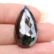 pear cut , grey black natural loose diamond , what does diamond represent in engagement ring symbolism and love