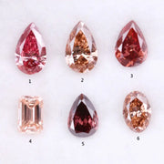 Six lab grown fancy colored diamonds in pink, blush, champagne and deep rose tones featuring pear, oval and emerald cuts displayed on a white background for fine jewelry design.