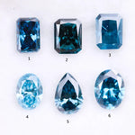 Six lab grown blue diamonds in emerald, oval and pear cuts displaying fancy deep ocean blue color arranged on white background for custom engagement ring and fine jewelry making.