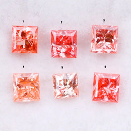 Six square princess cut pink lab grown diamonds in varying shades from light blush to vivid pink, displayed on a white background, featuring brilliant faceting and high clarity for luxury jewelry settings.