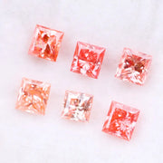 Six square princess cut pink lab grown diamonds in varying shades from light blush to vivid pink, displayed on a white background, featuring brilliant faceting and high clarity for luxury jewelry settings.