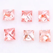 Six square princess cut pink lab grown diamonds in varying shades from light blush to vivid pink, displayed on a white background, featuring brilliant faceting and high clarity for luxury jewelry settings.