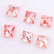 Six square princess cut pink lab grown diamonds in varying shades from light blush to vivid pink, displayed on a white background, featuring brilliant faceting and high clarity for luxury jewelry settings.