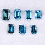 Close-up of emerald-cut lab-grown blue diamonds showcasing exceptional clarity and vibrant color, ideal for high-end jewelry designs.