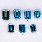 Close-up of emerald-cut lab-grown blue diamonds showcasing exceptional clarity and vibrant color, ideal for high-end jewelry designs.