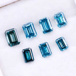 Close-up of emerald-cut lab-grown blue diamonds showcasing exceptional clarity and vibrant color, ideal for high-end jewelry designs.