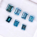 Close-up of emerald-cut lab-grown blue diamonds showcasing exceptional clarity and vibrant color, ideal for high-end jewelry designs.