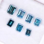 Close-up of emerald-cut lab-grown blue diamonds showcasing exceptional clarity and vibrant color, ideal for high-end jewelry designs.