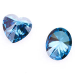 Oval and heart shaped fancy deep blue lab grown diamonds with brilliant faceting, showcasing vivid teal blue tones and VS clarity on a white background.