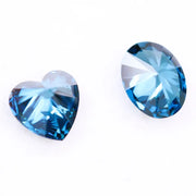 Oval and heart shaped fancy deep blue lab grown diamonds with brilliant faceting, showcasing vivid teal blue tones and VS clarity on a white background.
