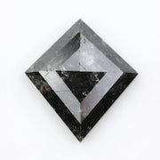 sharp kite cut rustic black diamond gemstone showcasing brilliant, highly reflective facets across a sleek triangular silhouette.