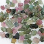 Natural rough tourmaline crystals multiple colors lot with green pink blue yellow and multicolor gemstones
