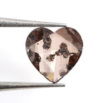 brown color gold heart necklace with diamond in the middle