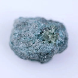 Rough brown diamond with natural uncut surface and earthy tones perfect for raw gemstone jewelry