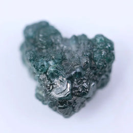 Raw white diamond stone in natural unpolished form showing crystal structure and brilliance potential