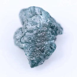 Rough diamond rocks in natural form showing uncut gemstone structure and authentic diamond appearance