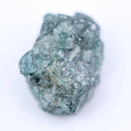 Raw gemstone jewelry featuring natural uncut diamonds with organic textures and rustic design