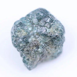 Natural diamond raw stone in rough form with visible crystal structure and unpolished surface