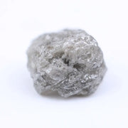 Salt and pepper diamond rough crystal with natural inclusions and rustic grey appearance.