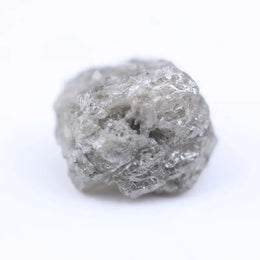 Salt and pepper diamond rough crystal with natural inclusions and rustic grey appearance.