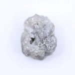 Salt and pepper diamond rough crystal with natural inclusions and rustic grey appearance.