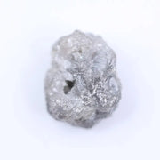Salt and pepper diamond rough crystal with natural inclusions and rustic grey appearance.